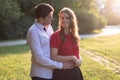 Young couple in love hugging in the park