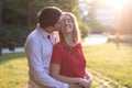 Young couple in love hugging in the park