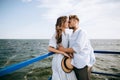 Young couple in love kissing and hugging on the sea pier. summer holidays Royalty Free Stock Photo