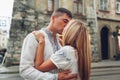 Young couple in love kissing in old Lviv city wearing traditional ukrainian shirts. Man and woman hug Royalty Free Stock Photo