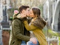 Young couple in love kissing tenderly on street celebrating Valentines day or anniversary cheering in Champagne Royalty Free Stock Photo