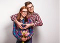 Young couple in love make a heart and hands are holding tulips. Royalty Free Stock Photo