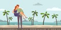 Young couple of lovers. Man and woman on a romantic date on a tropical beach with palm trees. A man carries a woman on Royalty Free Stock Photo