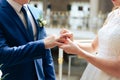 Young couple in love newlyweds exchange gold wedding rings 1 Royalty Free Stock Photo