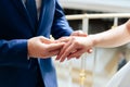 Young couple in love newlyweds exchange gold wedding rings 1 Royalty Free Stock Photo