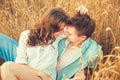 Young couple in love outdoor.d.Couple hugging.Young beautiful couple in love staying and kissing on the field on sunset.