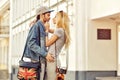 Young couple in love outdoor. Sensual outdoor portrait of young stylish couple posing in an old town