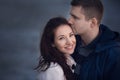 Young couple in love outdoor. They are smiling and looking at each other Royalty Free Stock Photo