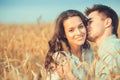Young couple in love outdoor.Stunning sensual outdoor portrait of young stylish fashion couple posing in summer in field Royalty Free Stock Photo