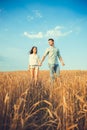 Young couple in love outdoor.Stunning sensual outdoor portrait of young stylish fashion couple posing in summer in field.Happy Royalty Free Stock Photo
