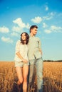 Young couple in love outdoor. Stunning sensual outdoor portrait of young stylish fashion couple posing in summer in field. Happy Royalty Free Stock Photo