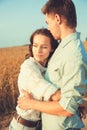 Young couple in love outdoor.Stunning sensual outdoor portrait of young stylish fashion couple posing in summer in field