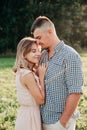 Young couple in love outdoor.Stunning sensual portrait of young couple posing in summer in field Royalty Free Stock Photo