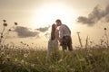 Young couple in love outdoor at the sunset