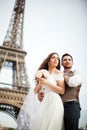 Young couple in love in paris on their wedding day Royalty Free Stock Photo