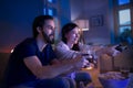 Young couple in love playing video games indoors at home. Royalty Free Stock Photo