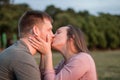 Young couple in love sharing a kiss at the beach Royalty Free Stock Photo