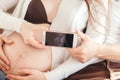 Young couple in love showing an ultrasound picture of their baby Royalty Free Stock Photo