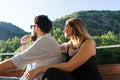 Young couple in love sitting in a boat. Happy romantic ambiance, sensual young couple lovers, teenagers hugging outdoors in summer Royalty Free Stock Photo