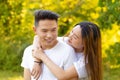 Young couple in love smiles and strolls in the park