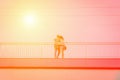 Young couple in love takes selfie portrait on the bridge. Yellow orange toned