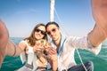 Young couple in love taking selfie on sailing boat Royalty Free Stock Photo