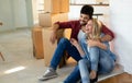 Young couple unpacking cardboard boxes at new home moving in concept Royalty Free Stock Photo