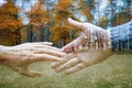 Young couple in love walking in autumn park holding hands close-up. Royalty Free Stock Photo