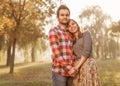 Young couple in love walking in the autumn park