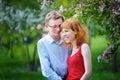 Young couple in love walking at the blossoming spring garden Royalty Free Stock Photo