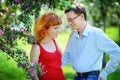 Young couple in love walking at the blossoming spring garden Royalty Free Stock Photo