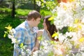 Young couple in love walking in the blossoming spring garden Royalty Free Stock Photo