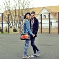 Young couple in love walking in city park holding hands Royalty Free Stock Photo