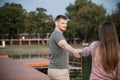 Young couple in love walking on the dock by the lake Royalty Free Stock Photo