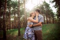 A young couple in love walking in the woods