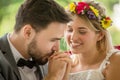 young couple in love Wedding Bride and groom kissing hand in the park. Newlyweds. Closeup portrait of a beautiful having a Royalty Free Stock Photo