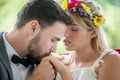 young couple in love Wedding Bride and groom kissing hand in the park. Newlyweds. Closeup portrait of a beautiful having a Royalty Free Stock Photo