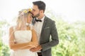 young couple in love Wedding Bride and groom kissing in the park. Newlyweds. Closeup portrait of a beautiful having a romantic Royalty Free Stock Photo