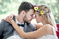 young couple in love Wedding Bride and groom kissing in the park. Newlyweds. Closeup portrait of a beautiful having a romantic Royalty Free Stock Photo