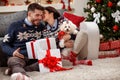 Young couple with white Meltzer as Christmas gift Royalty Free Stock Photo