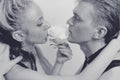 Young couple in love with a white rose and silver make-up