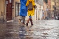 A young couple in love who is walking the city on a rainy day. Walk, rain, city, relationship Royalty Free Stock Photo