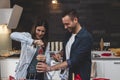 Young couple of lovers celebrating at home drinking wine Royalty Free Stock Photo