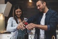 Young couple of lovers celebrating at home drinking wine Royalty Free Stock Photo