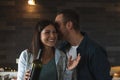 Young couple of lovers celebrating at home drinking wine Royalty Free Stock Photo