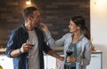 Young couple of lovers celebrating at home drinking wine Royalty Free Stock Photo