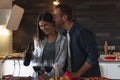 Young couple of lovers celebrating at home drinking wine Royalty Free Stock Photo