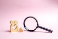 A young Couple of lovers of lovers are standing near to a magnifying glass. concept of finding a couple on Valentine`s Day. Royalty Free Stock Photo