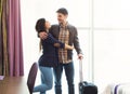 Young couple with luggage in hotel room Royalty Free Stock Photo