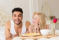 Young Couple Lying In Bed Eat Breakfast Morning With Red Rose Flower, Happy Smile Hispanic Man And Woman